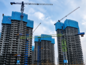 Tower cranes working on a high-rise construction project